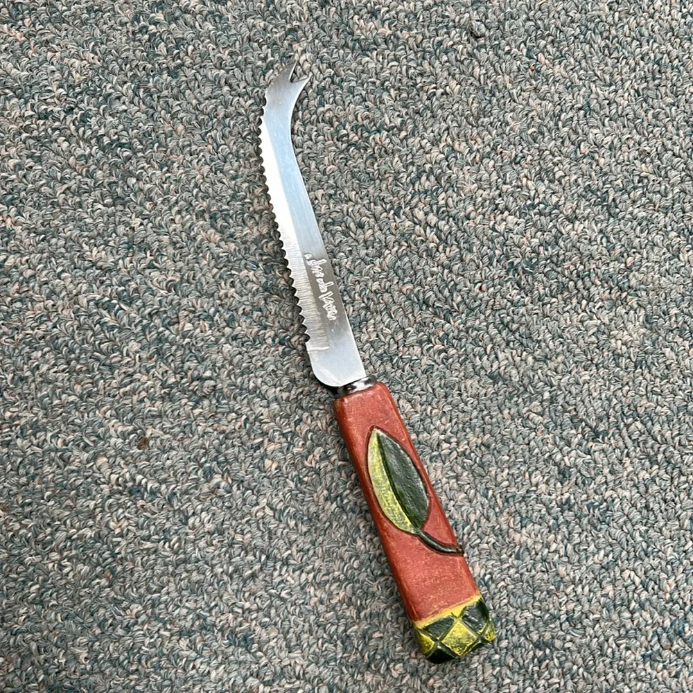 Joie de Vivre hooked blade cheese knife w carved leaf handle. Perfect addition !